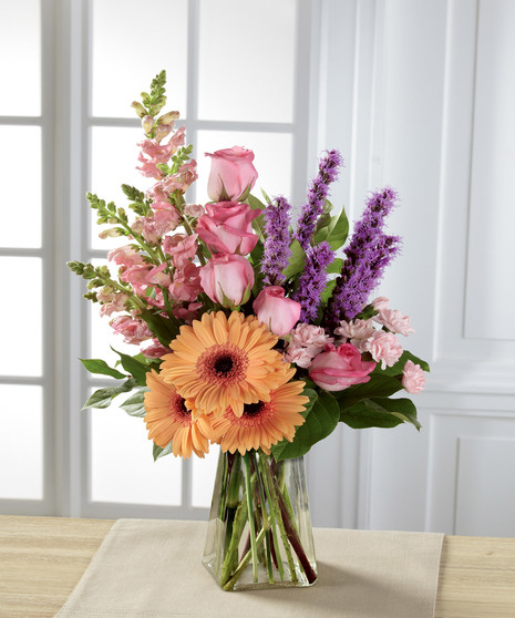 pastel floral arrangement in pink and orange